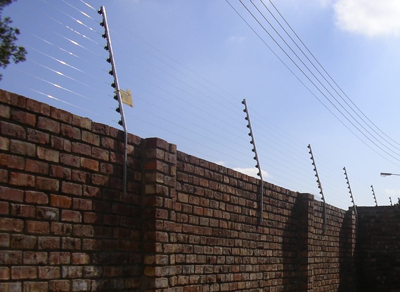 Electric fence on top of a wall